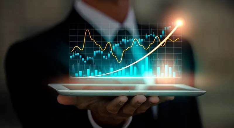 Australian business owner reviewing financial trends on a tablet dashboard