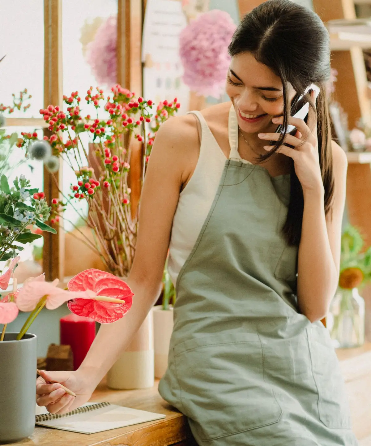 Florist taking a phone call in her shop