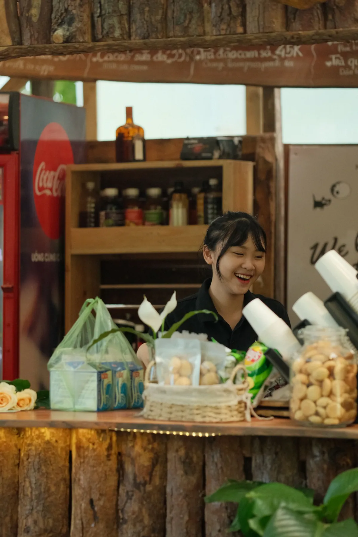 Business owner reviewing paperwork at the counter of her shop